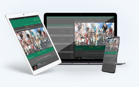 Un laptop, uno smartphone e un tablet connessi ad un sito di scommesse con live streaming di ciclismo