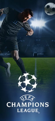 Un giocatore colpisce una palla di testa in campo, sullo sfondo il logo della Champions League