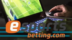 Il logo di esportsbetting.com con un laptop sullo sfondo