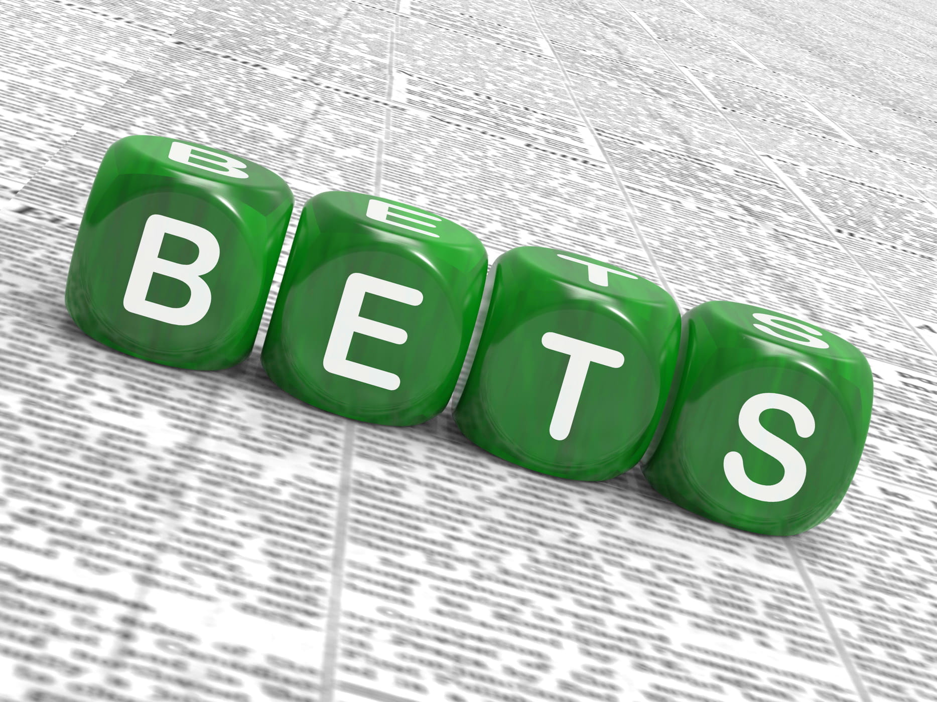 Quattro dadi verdi compongono la scritta “bets”