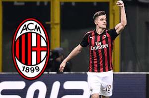 Krzysztof Piątek e il logo del Milan