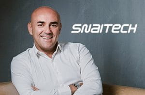 Fabio Schiavolin, AD di Snaitech, e il logo dell'azienda