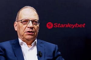 Giovanni Garrisi, CEO di Stanleybet, e il logo del bookmaker online