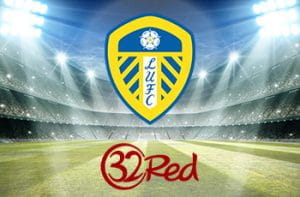 Il logo del Leeds United, il logo di 32Red, uno stadio di calcio in sottofondo