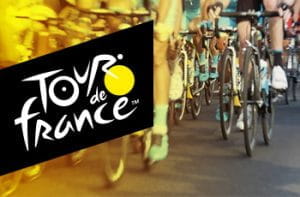 Il logo del Tour de France e un gruppo di ciclisti in azione