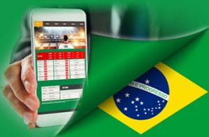La bandiera del Brasile e uno smartphone collegato a un sito di scommesse