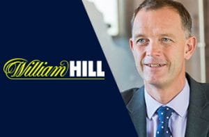 Il logo di William Hill e il CEO dimissionario Philip Bowcock
