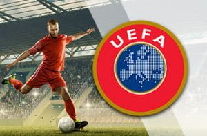 Un calciatore in azione e il logo della UEFA