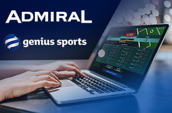 Il logo di Admiral, il logo di Genius Sports, un laptop e una mano che scrive