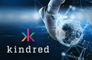 Il logo del gruppo Kindred e un piede che calcia un pallone