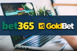 Un laptop e i loghi di bet365 e GoldBet