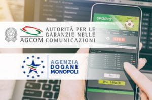 I loghi di AGCOM, ADM e uno smartphone e un laptop connessi al sito di un bookmaker