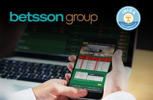 I loghi di Betsson, dell'UD Ibiza e uno smartphone collegato a un sito scommesse online