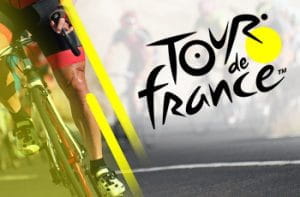 Il logo del Tour de France e le gambe di un ciclista