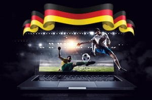 Lo schermo di un laptop con un calciatore in acrobazia e la bandiera della Germania
