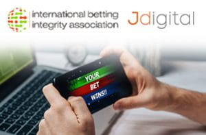 I loghi di IBIA e Jdigital e uno smartphone collegato a un sito scommesse online