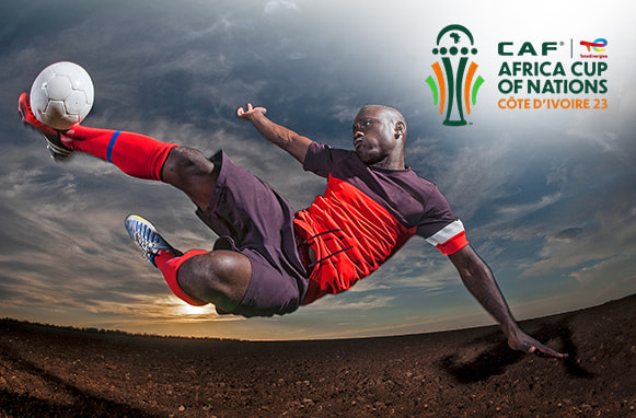 Calciatore in azione, logo Coppa d'Africa