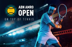 Tennis player in action, ATP Rotterdam logo