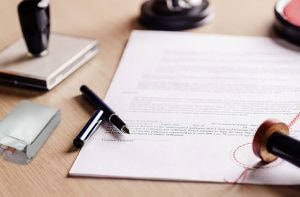 Table with contract and cigarette pack