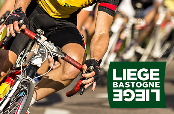 Ciclista in azione e logo Bastogne Liegi Bastogne