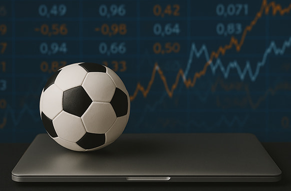 Laptop, pallone da calcio e grafici