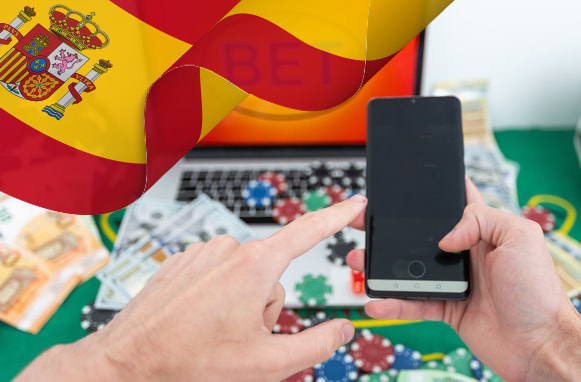 Smartphone, fiches e bandiera spagnola