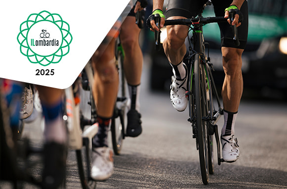 Ciclista in bicicletta e logo Giro di Lombardia