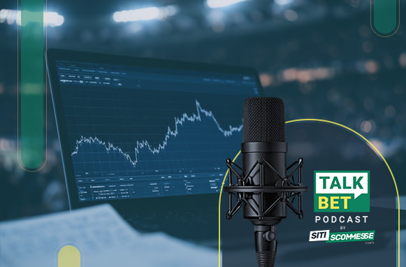 Grafico su pc, quaderno e logo TalkBet